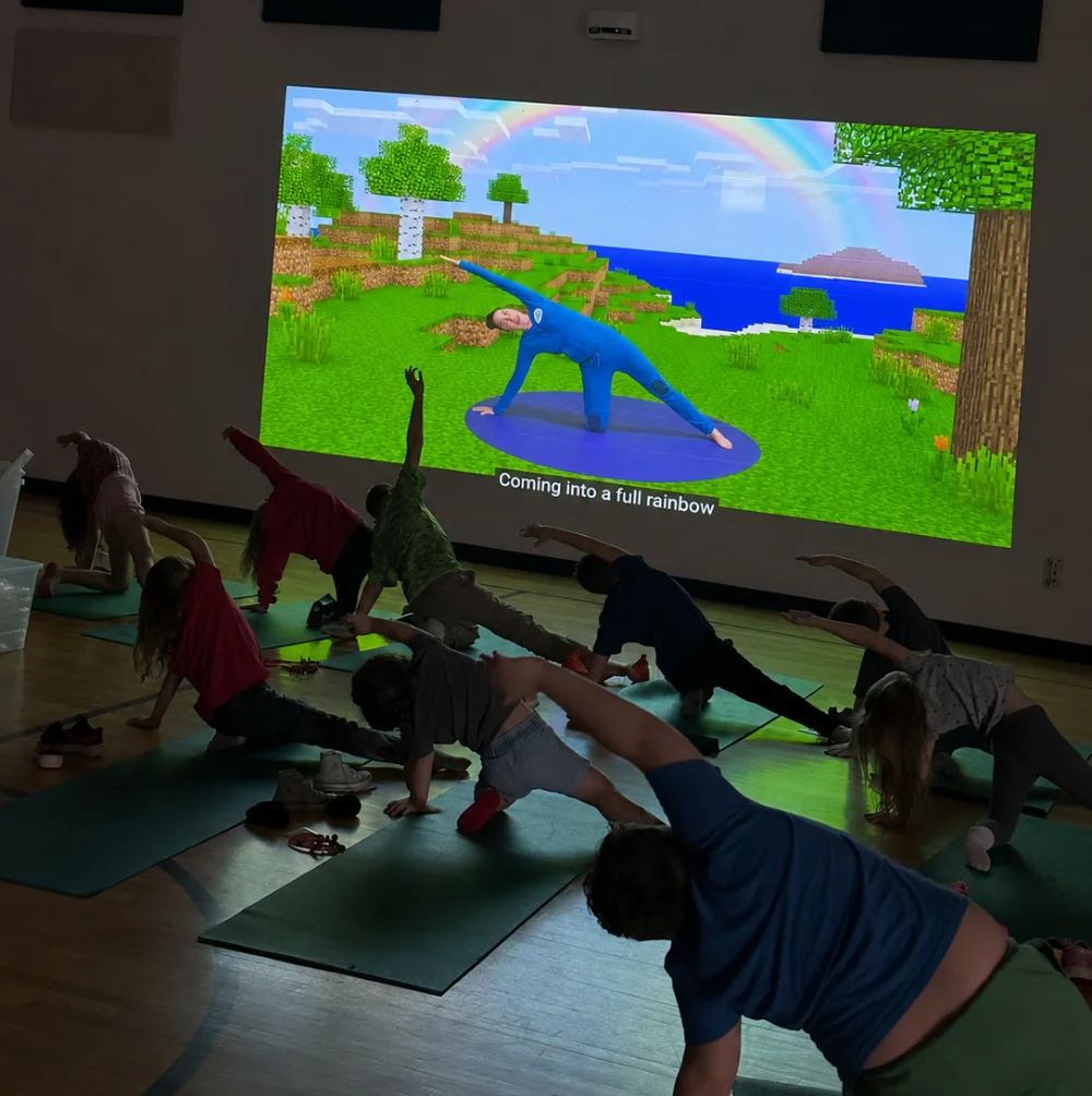 Kids stretching with an interactive projection screen