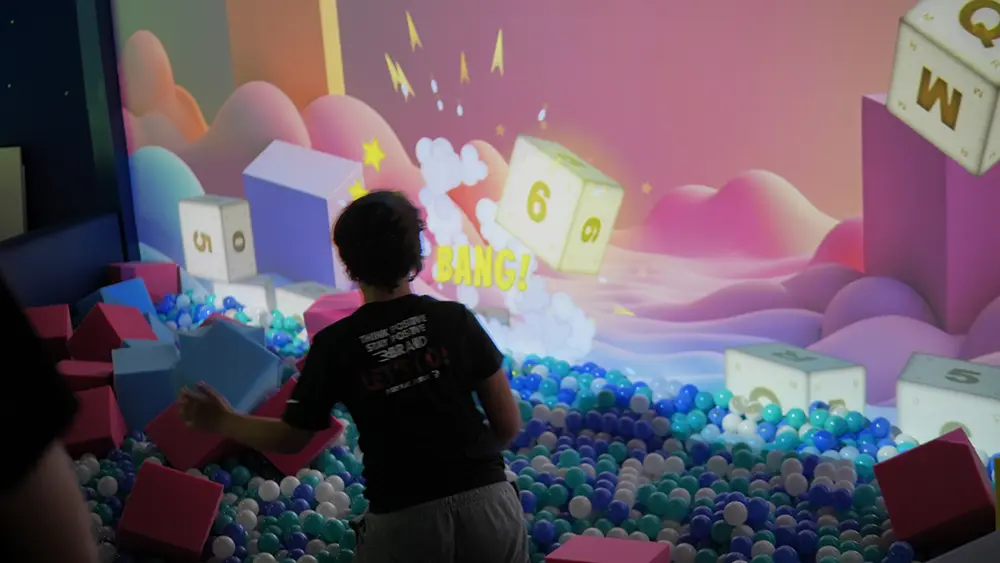 Interactive ball pit wall