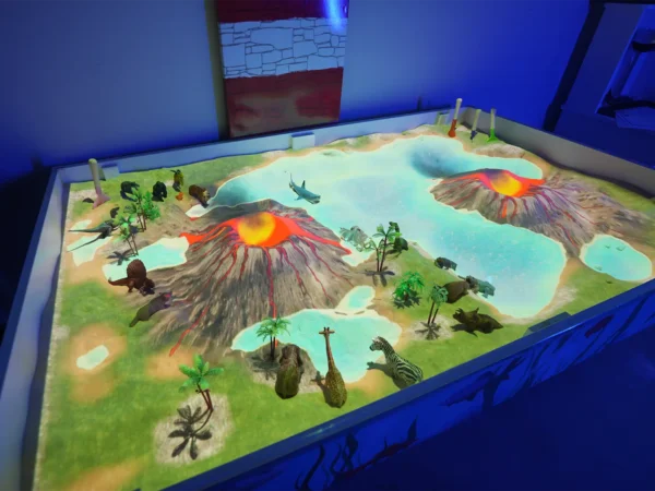 Interactive AR sandbox with volcanoes, water and animal figures