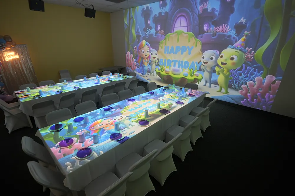 Children playing interactive projection games