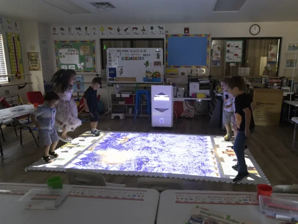 Children using the Interactive Mobile Floor in a classroom
