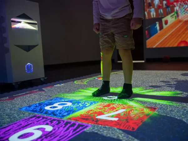 Child playing a motion-controlled game on the Interactive Mobile Floor