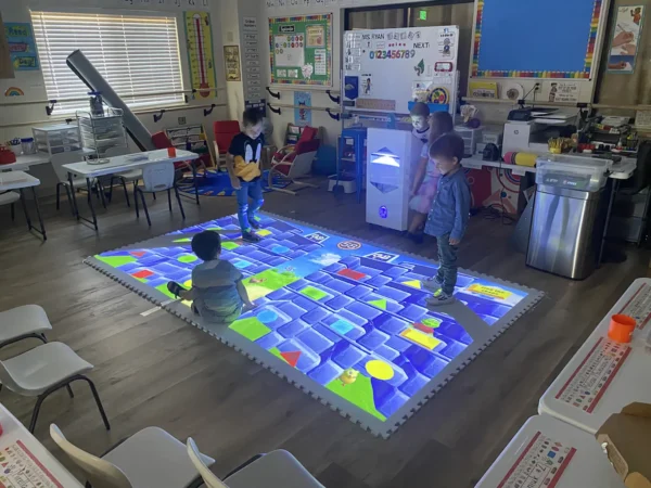 Students playing an educational game on the Interactive Mobile Floor