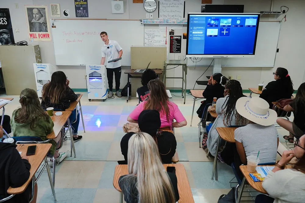 Specialist demonstrating interactive systems to teachers